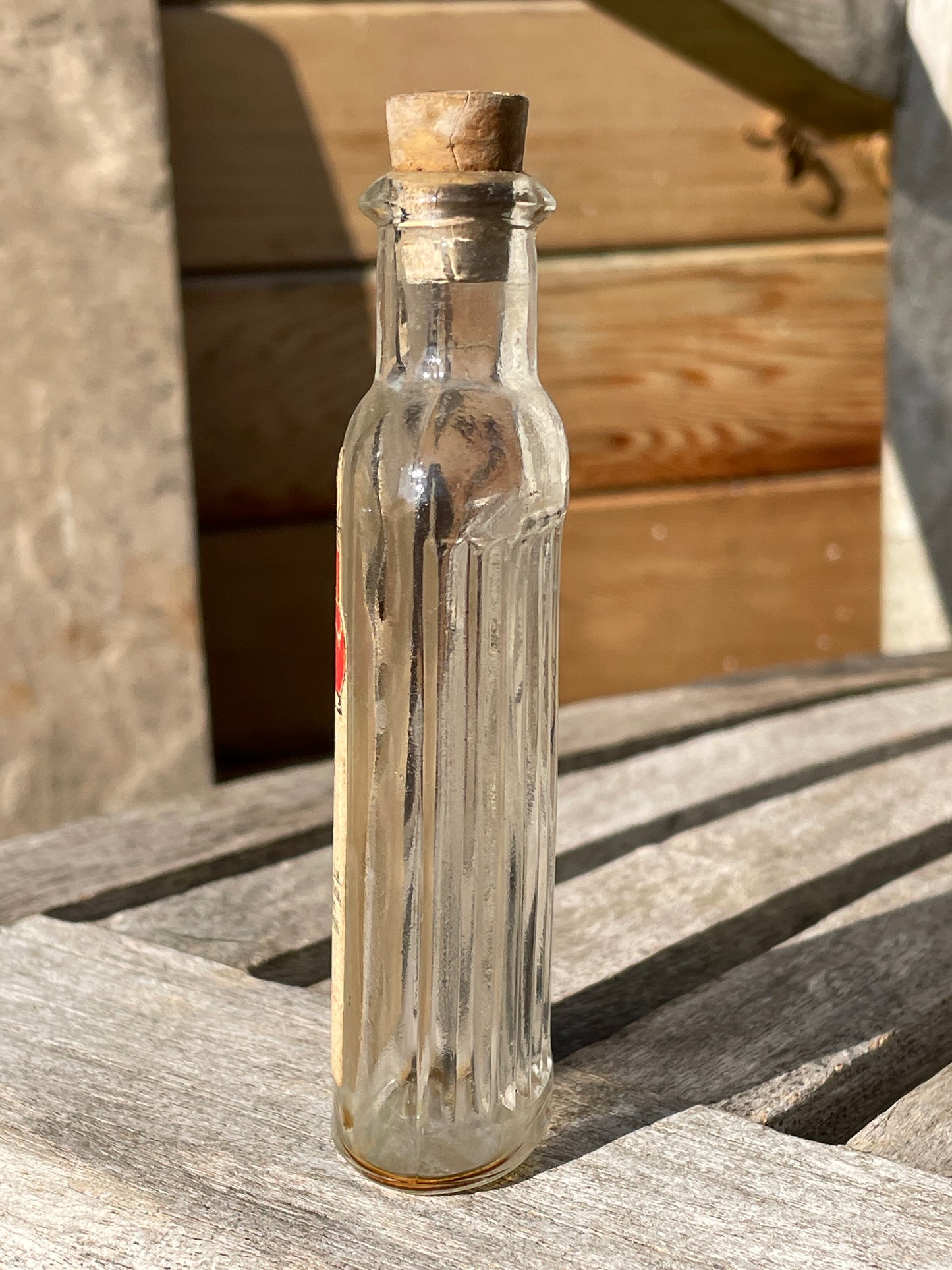 Antique Victorian bottle with original label and cork stopper 11cm tall