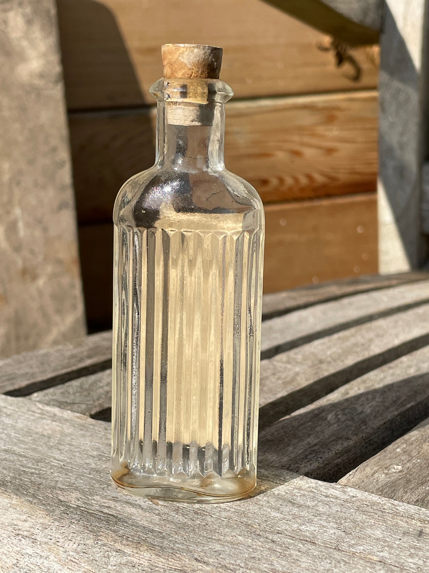 Antique Victorian bottle with original label and cork stopper 11cm tall