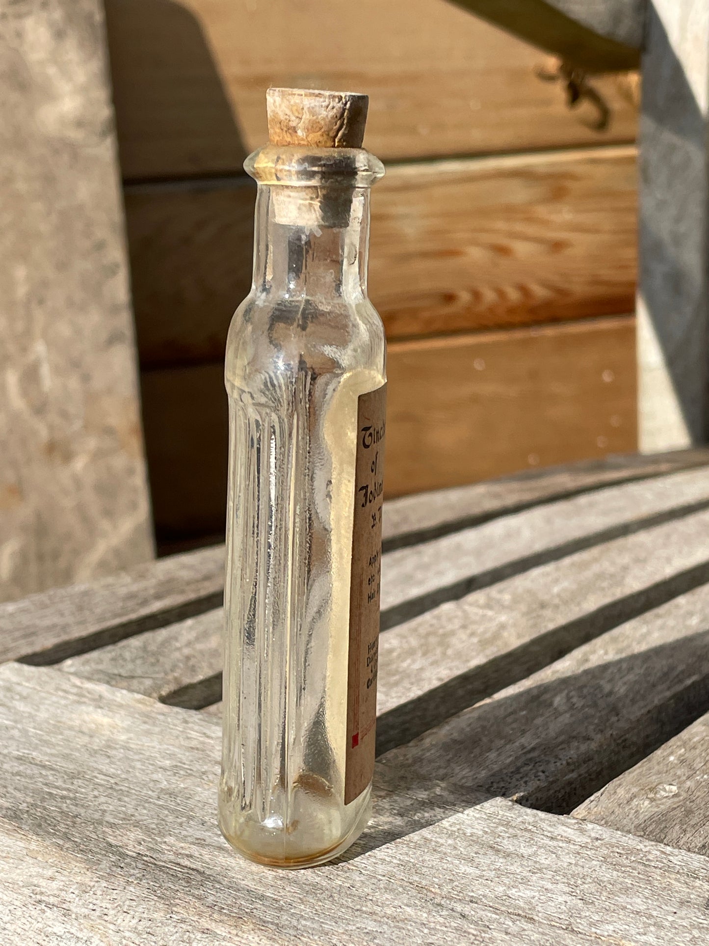 Antique Victorian bottle with original label and cork stopper 11cm tall
