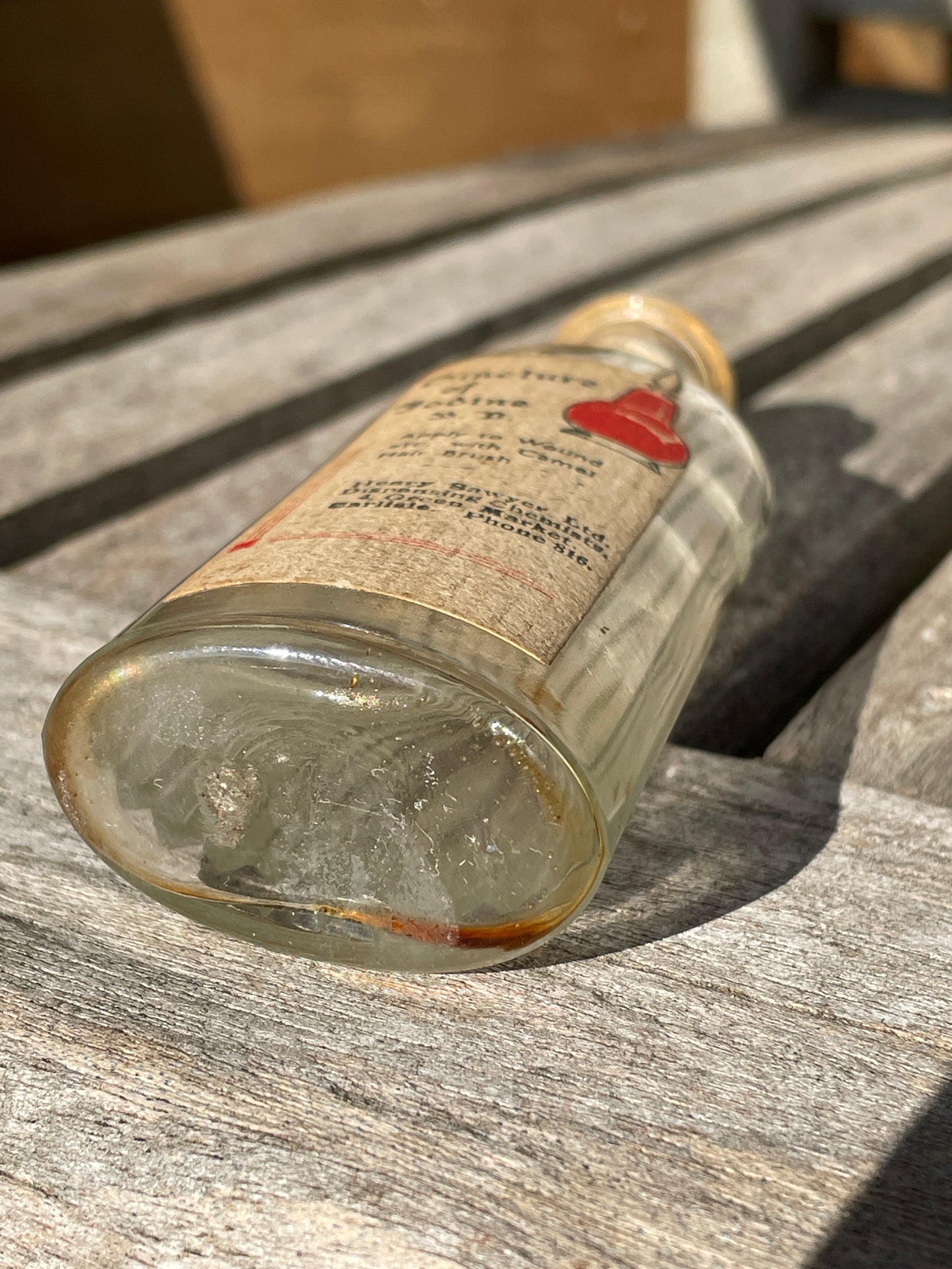 Antique Victorian bottle with original label and cork stopper 11cm tall