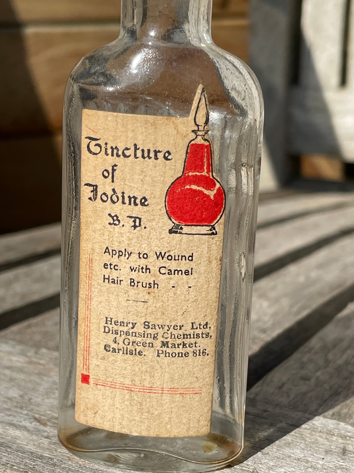 Antique Victorian bottle with original label and cork stopper 11cm tall