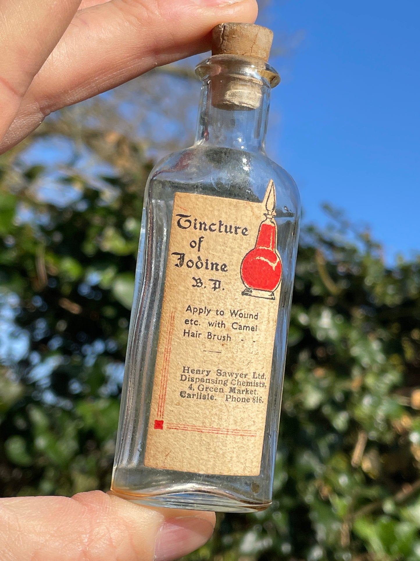 Antique Victorian bottle with original label and cork stopper 11cm tall