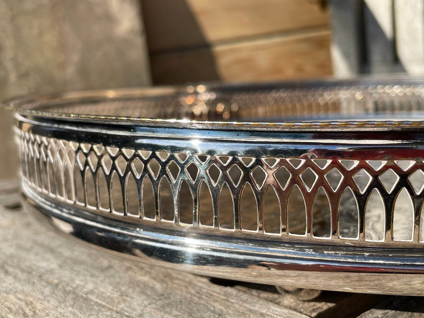 Early 20th century English silver plated galleried and ornately chased tray on three bun feet