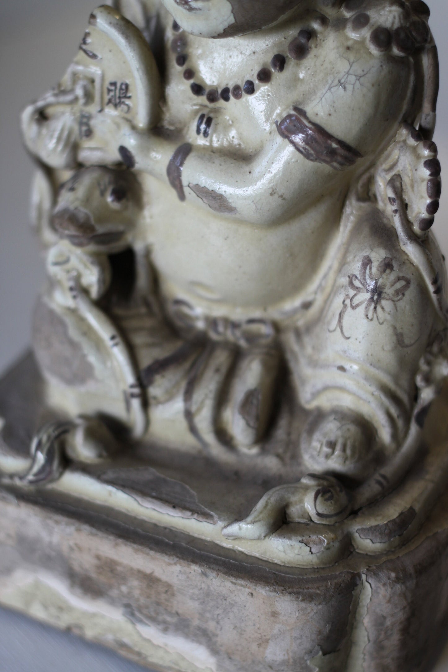 A Chinese Cizhou Seated Figure of Liu Hai, Possibly Ming Dynasty, 21cms high, Glaze Flaking
