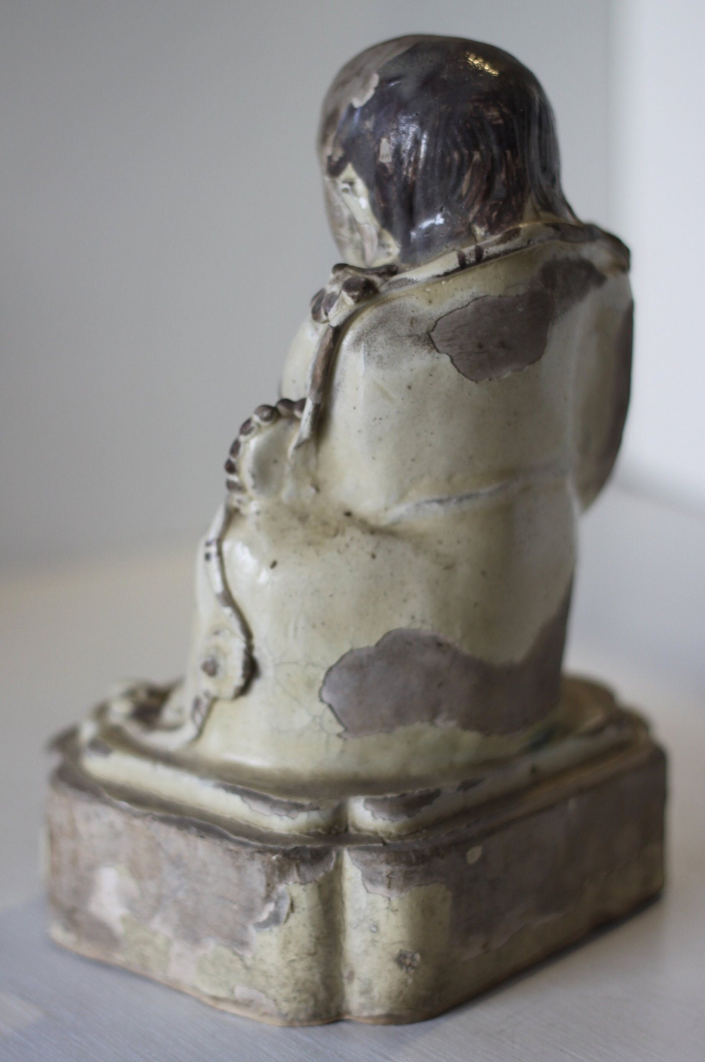 A Chinese Cizhou Seated Figure of Liu Hai, Possibly Ming Dynasty, 21cms high, Glaze Flaking