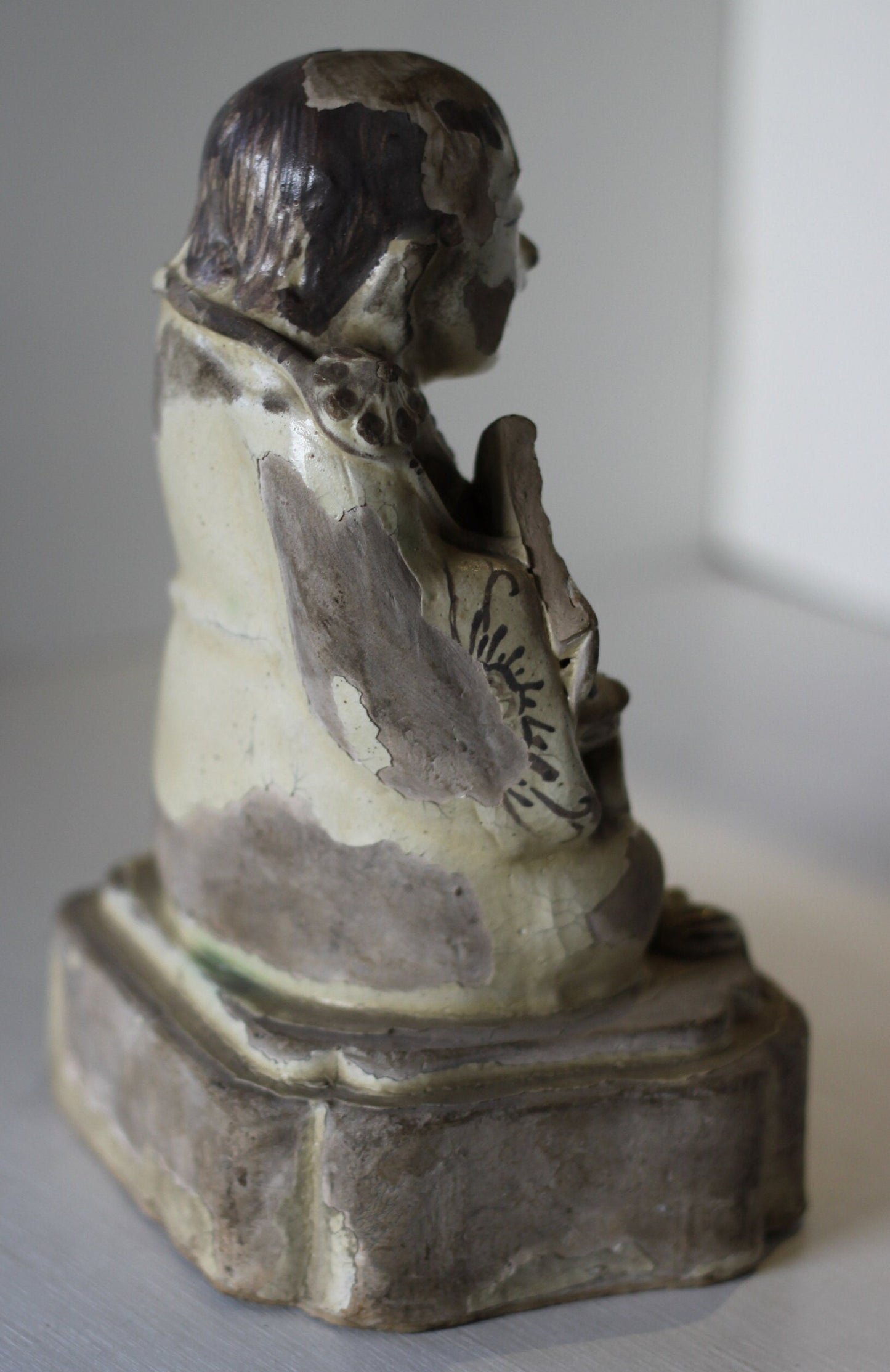 A Chinese Cizhou Seated Figure of Liu Hai, Possibly Ming Dynasty, 21cms high, Glaze Flaking