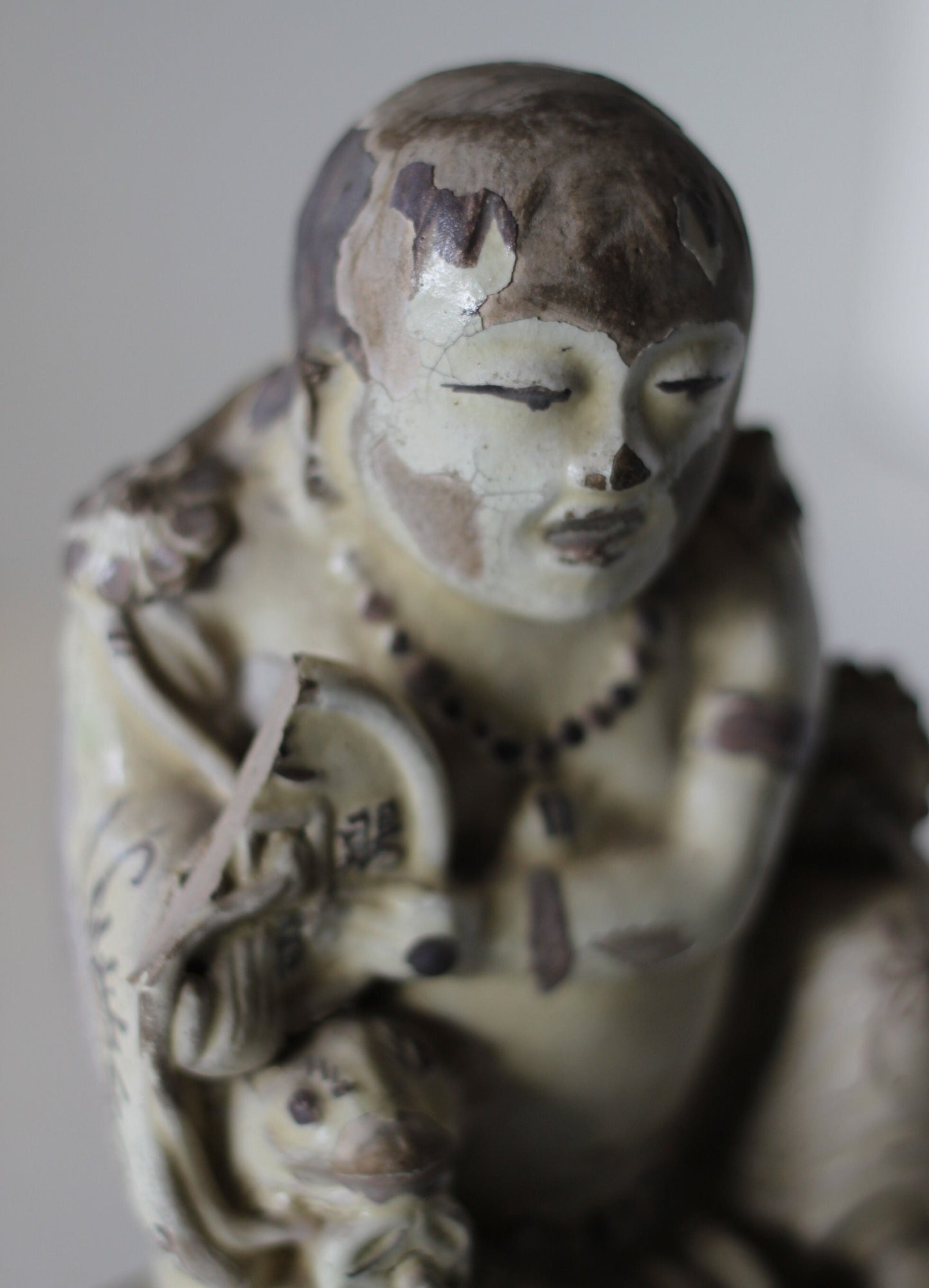 A Chinese Cizhou Seated Figure of Liu Hai, Possibly Ming Dynasty, 21cms high, Glaze Flaking