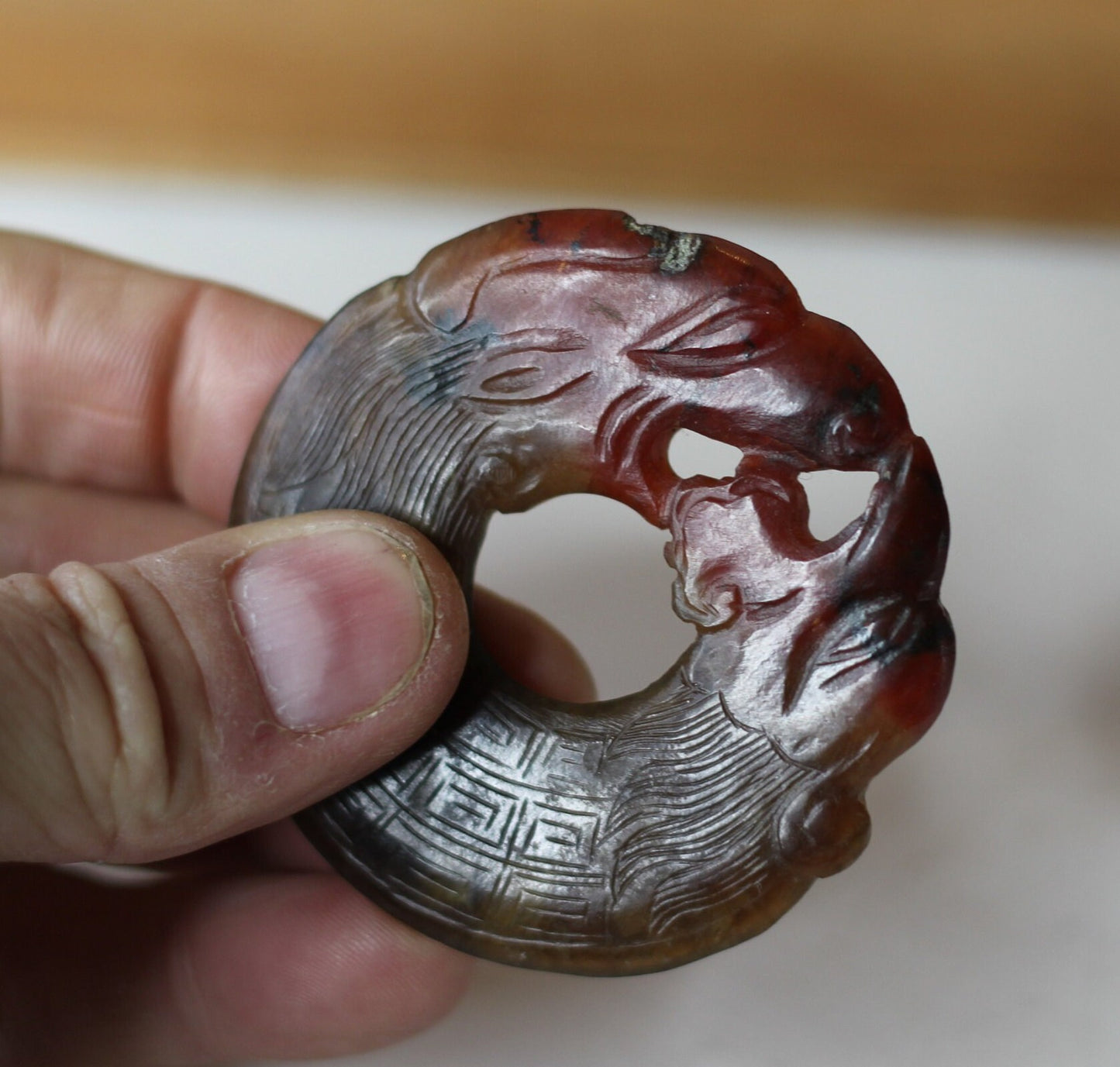 A Chinese Red Hardstone Bi Disc/Pendant 6.5cm Across