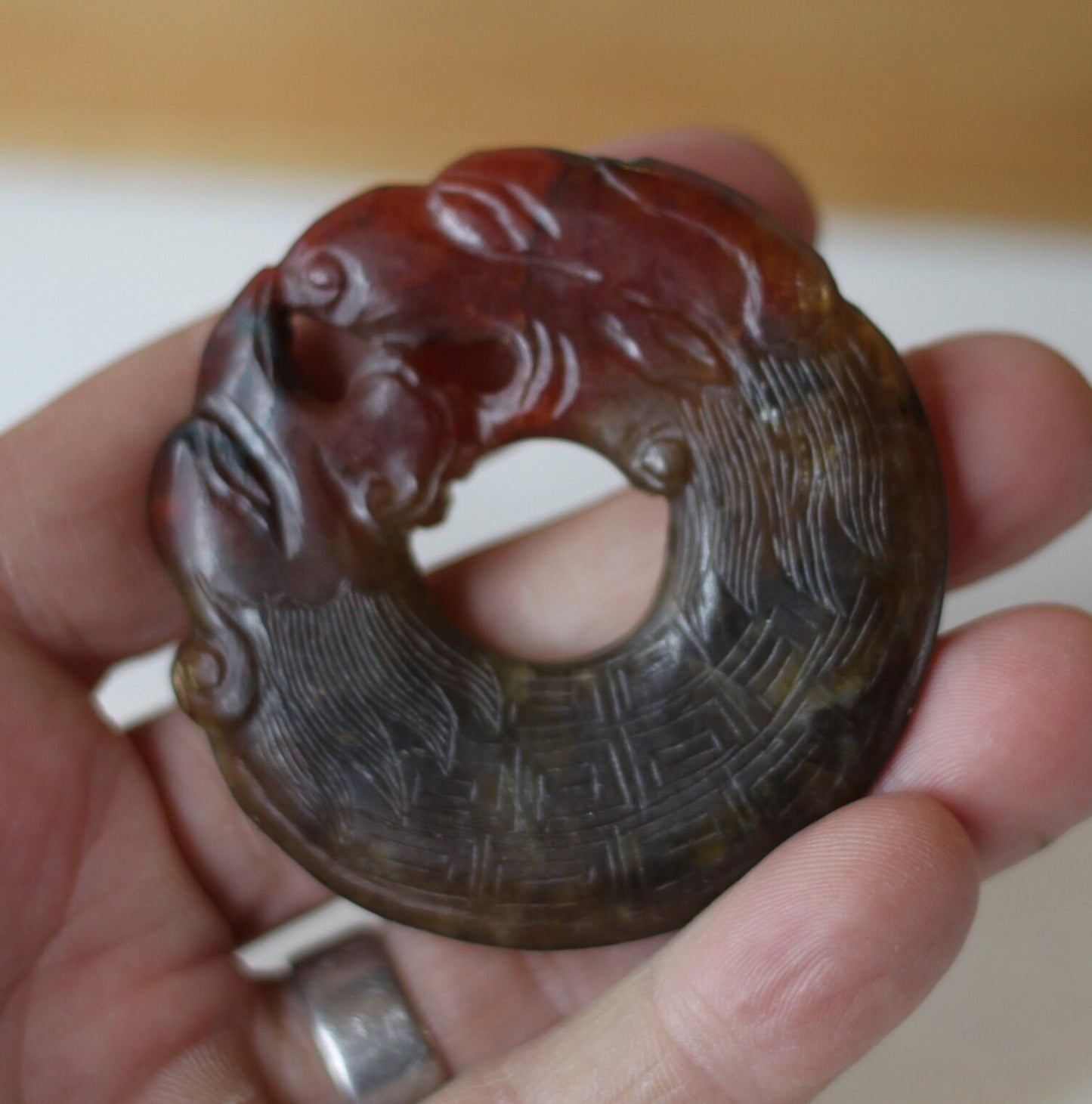 A Chinese Red Hardstone Bi Disc/Pendant 6.5cm Across