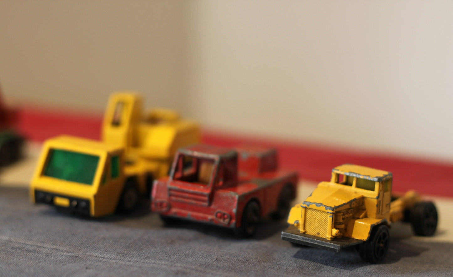 five diecast crane and dump truck toys by Corgi and Lesney from the 1960's and 70's - in Original Unrestored Condition