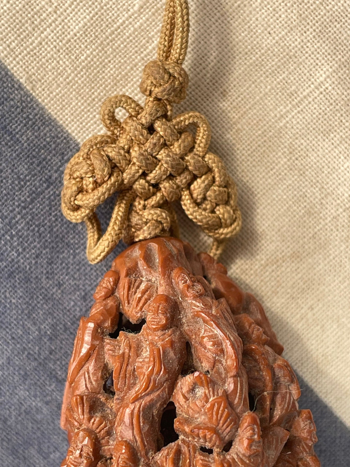 A Hand Carved Chinese Peach Stone Carving on a Silk Cord and Everlasting knot Tassel 42mm Long