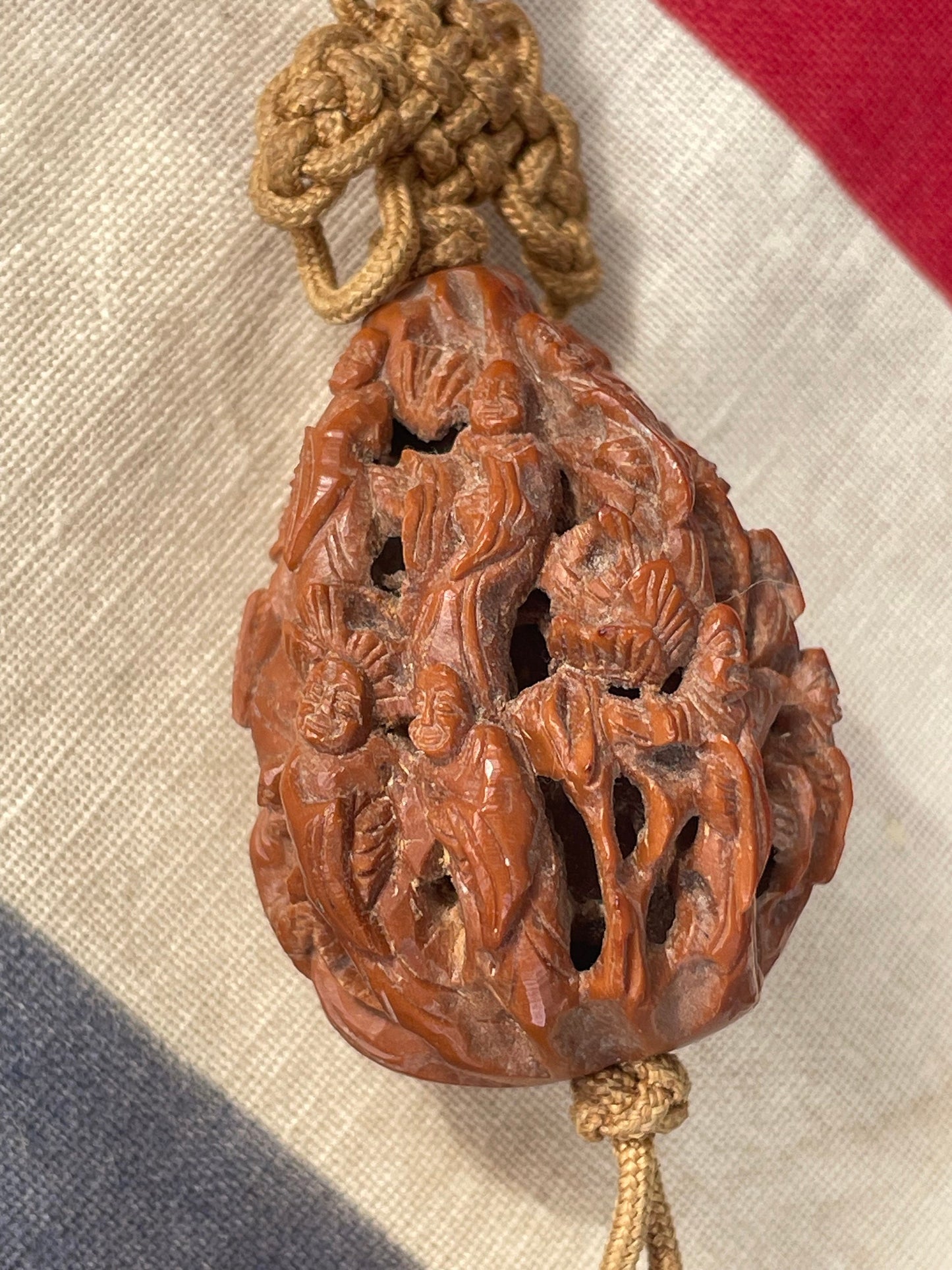A Hand Carved Chinese Peach Stone Carving on a Silk Cord and Everlasting knot Tassel 42mm Long