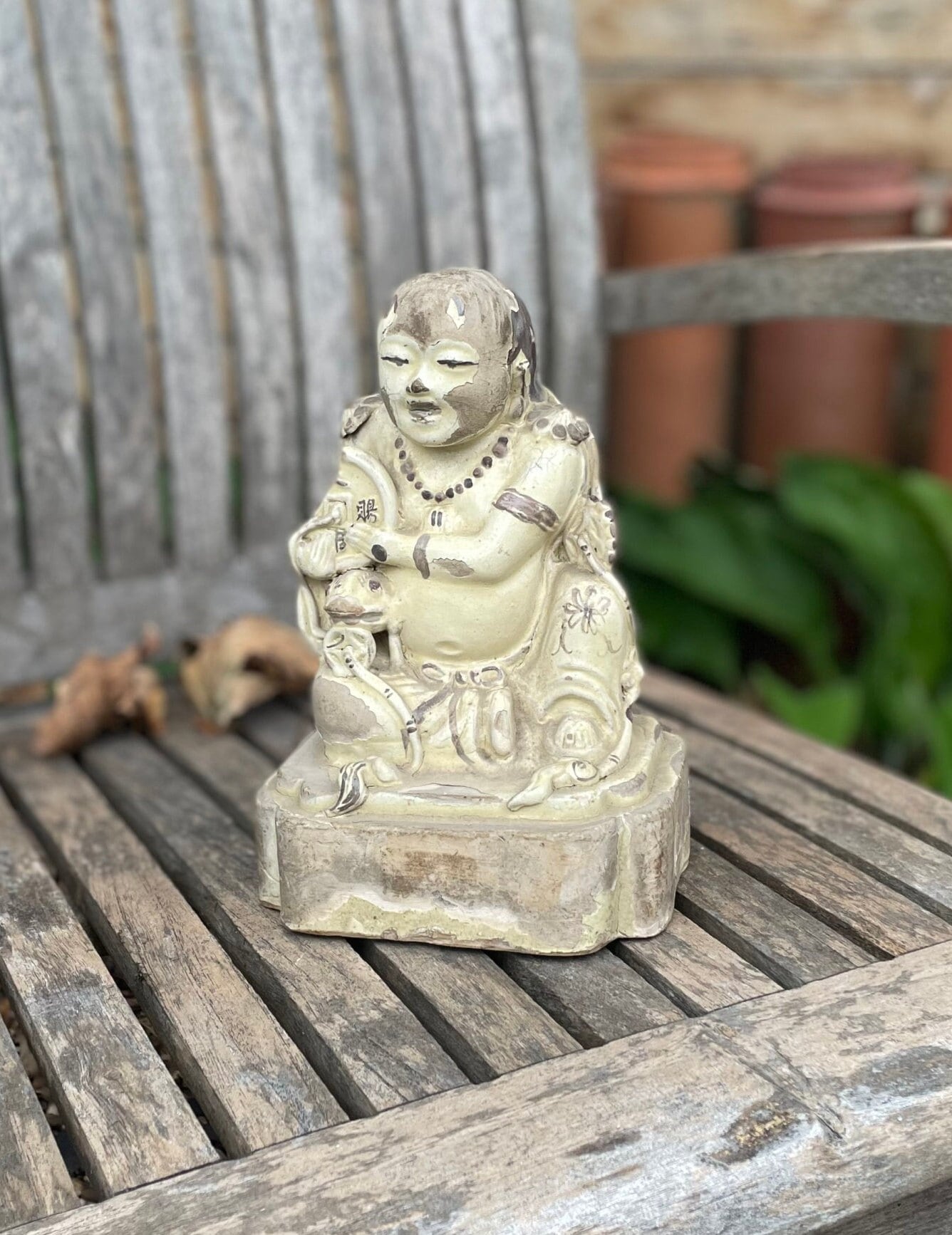 A Chinese Cizhou Seated Figure of Liu Hai, Possibly Ming Dynasty, 21cms high, Glaze Flaking