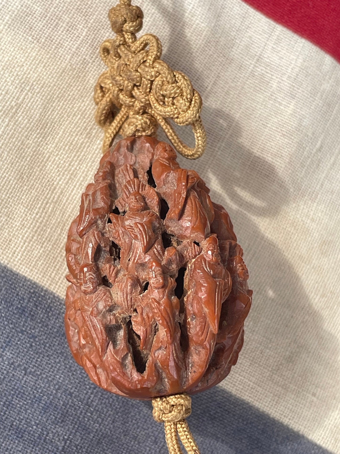 A Hand Carved Chinese Peach Stone Carving on a Silk Cord and Everlasting knot Tassel 42mm Long
