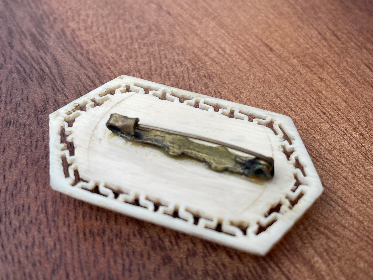 A Small Chinese Brooch With Hand Etched and Coloured Scene 5cm Wide