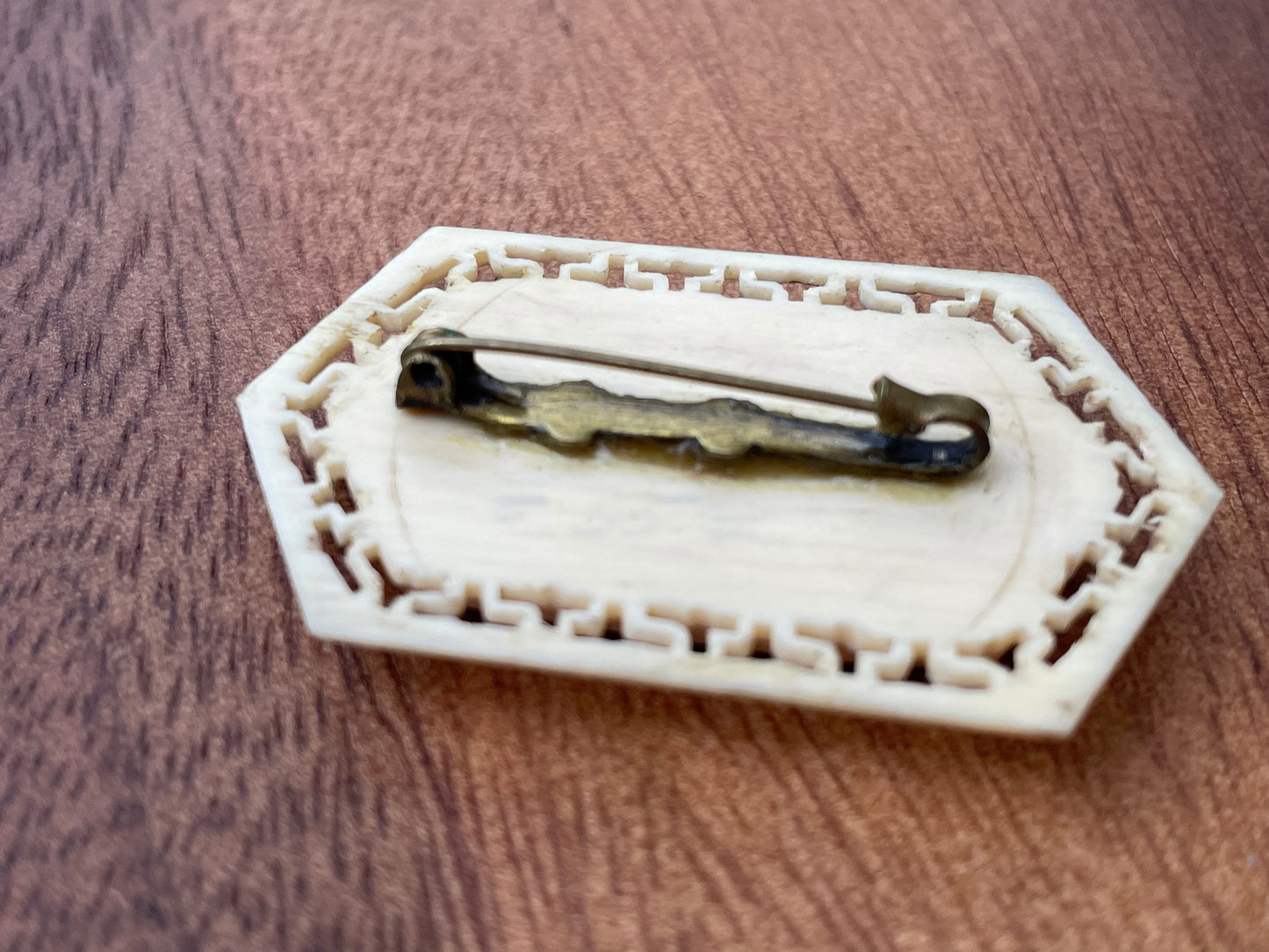 A Small Chinese Brooch With Hand Etched and Coloured Scene 5cm Wide