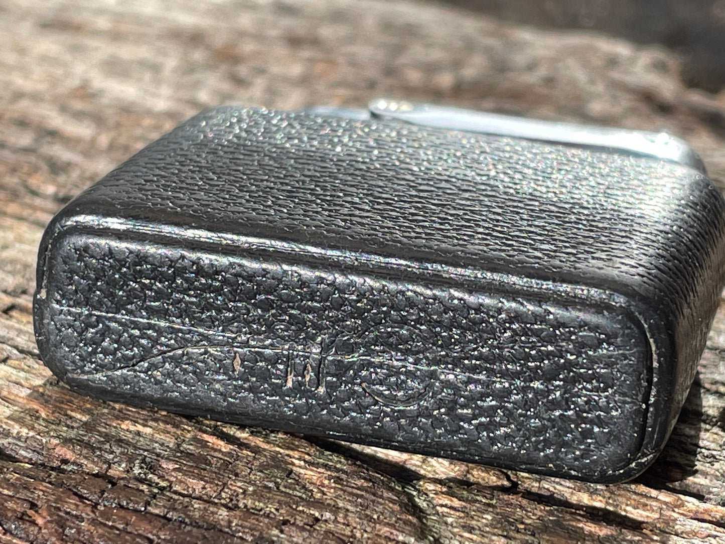 A vintage Colibri fuel lighter with faux leather base cap 4.5cm wide