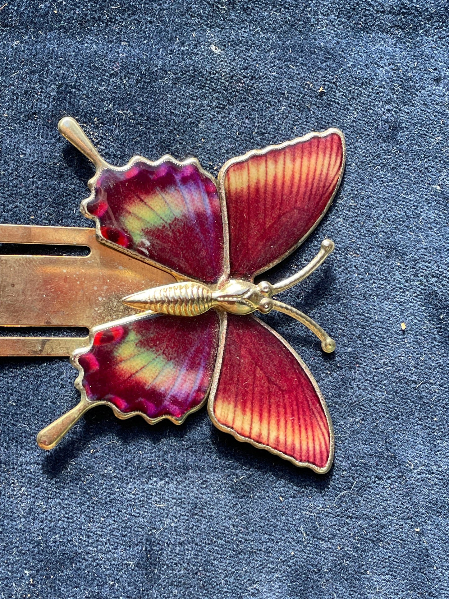 A vintage gold coloured enamel affect butterfly bookmark 6cm wide