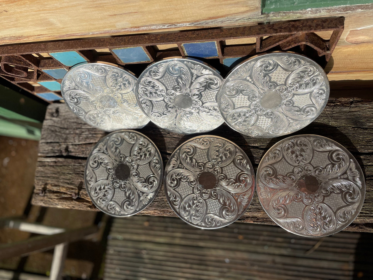 A vintage set of six English silver plated table place mats 16.5cm diameter