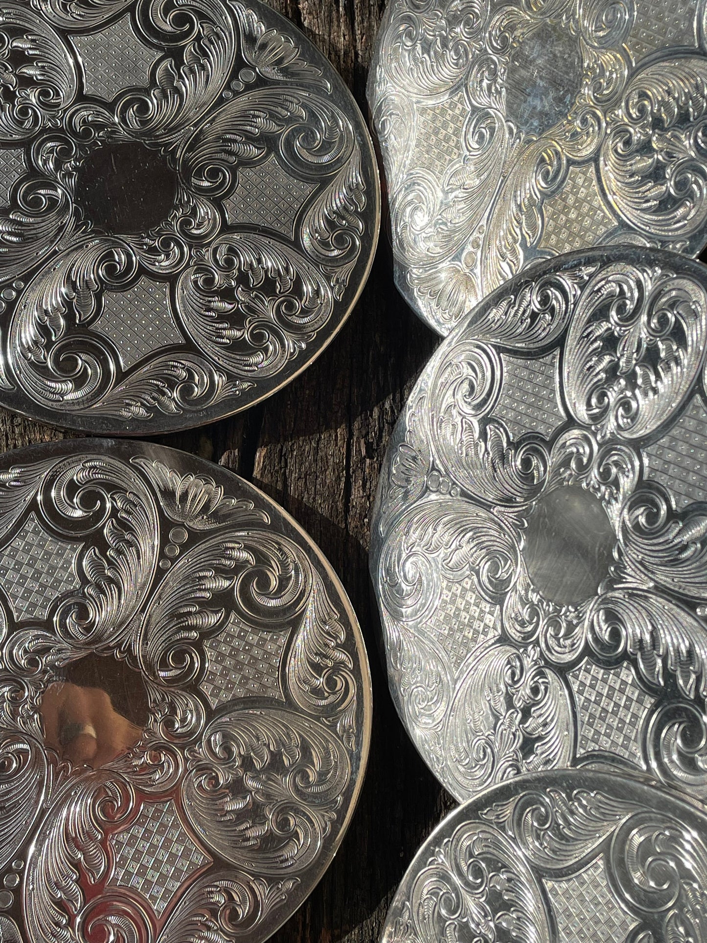 A vintage set of six English silver plated table place mats 16.5cm diameter