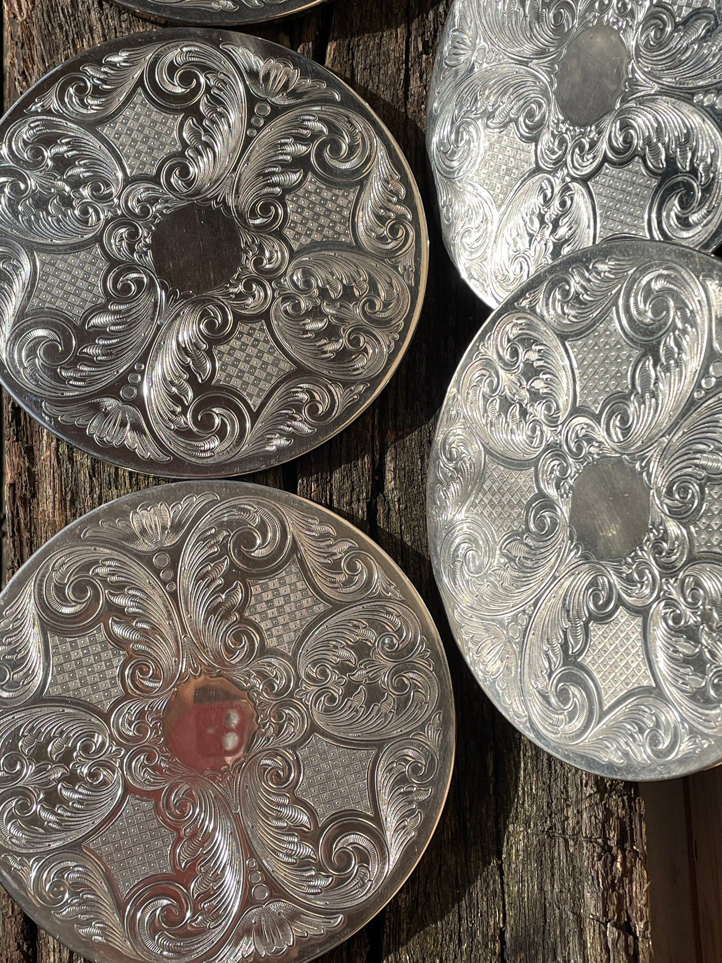 A vintage set of six English silver plated table place mats 16.5cm diameter