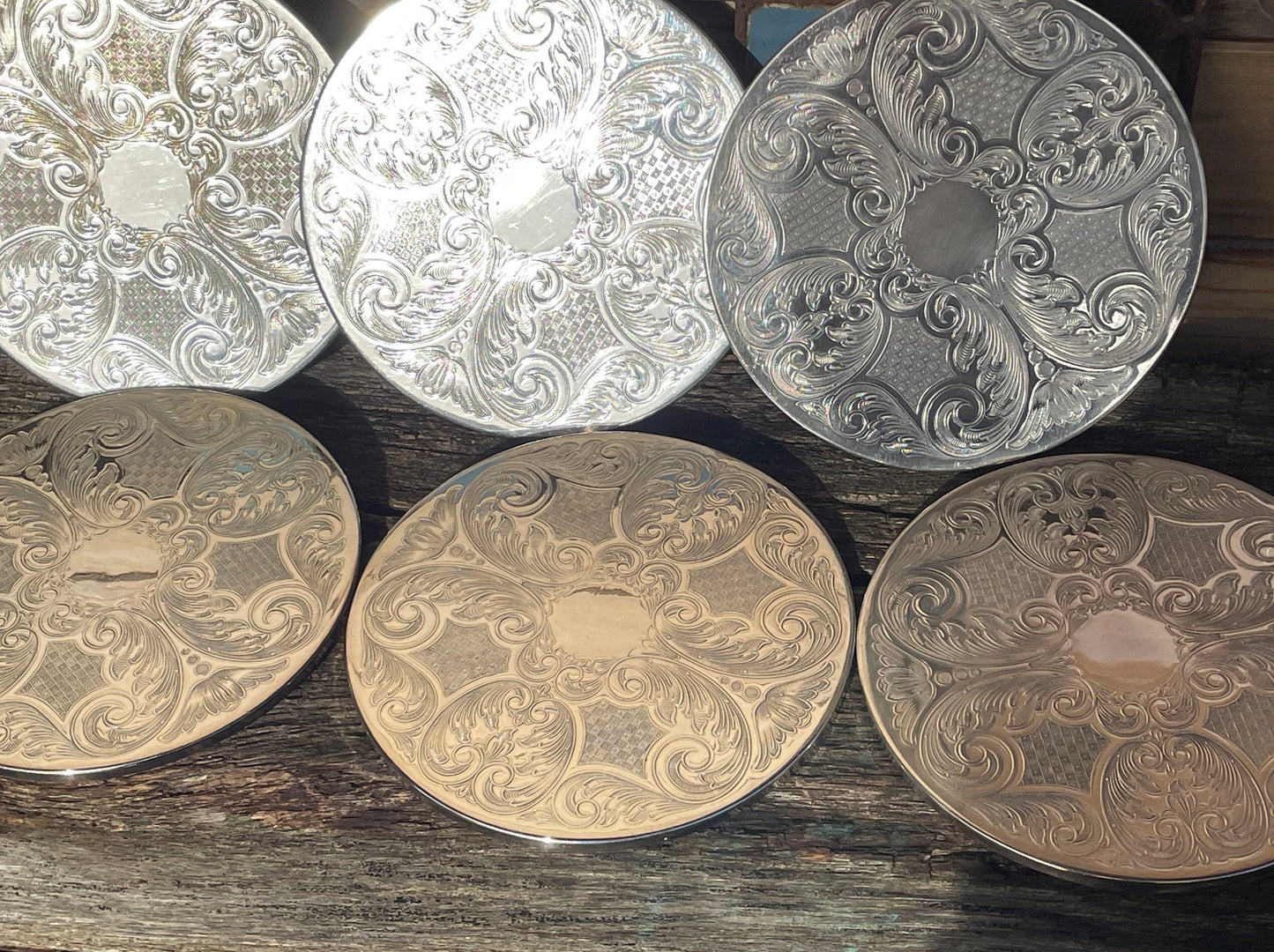 A vintage set of six English silver plated table place mats 16.5cm diameter