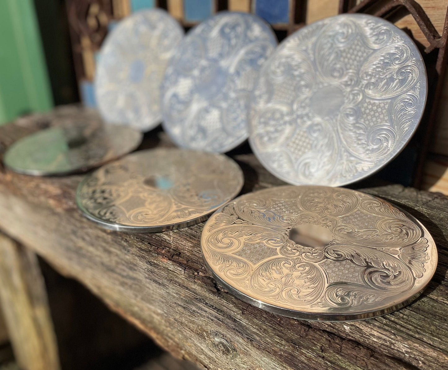 A vintage set of six English silver plated table place mats 16.5cm diameter