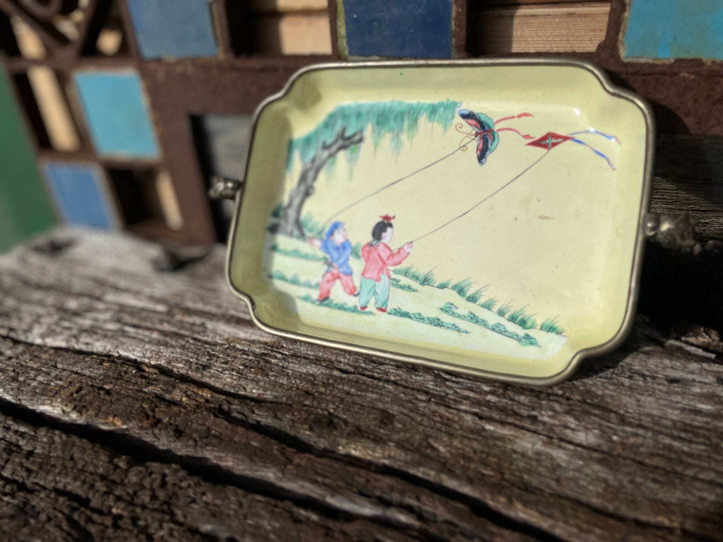 An antique hand painted Chinese enamel decorated pin tray with dragon handles 18cm wide c1900