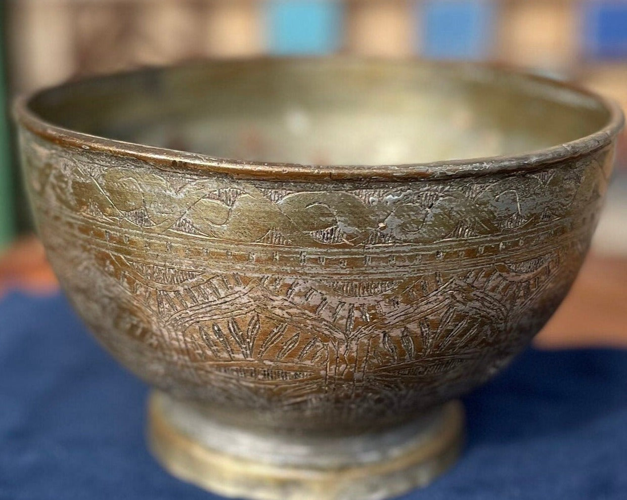 An antique Middle Eastern Bowl - heavily engraved and patinated with clear marks to base 16.5cm diameter