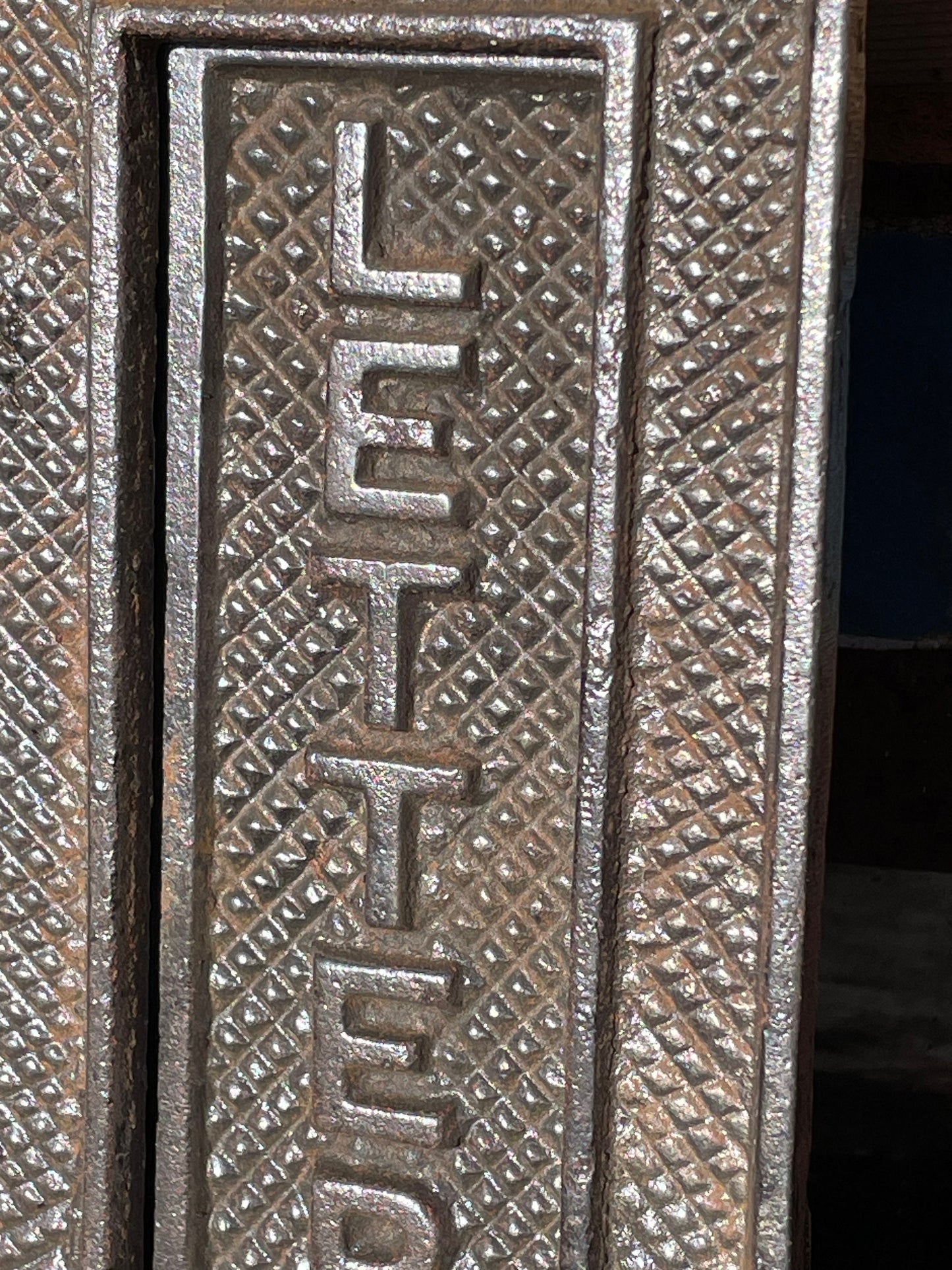 A heavy cast metal antique letter box fascia/flap 19cm tall