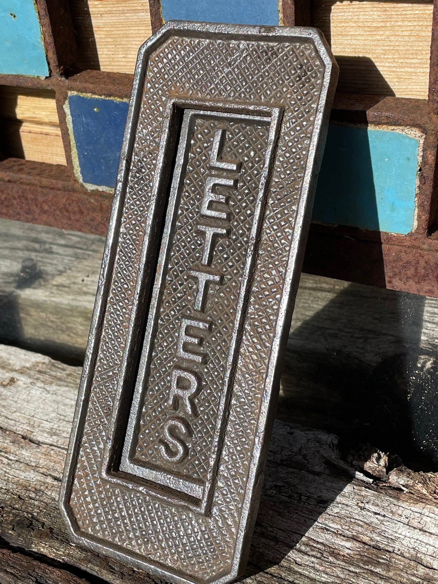 A heavy cast metal antique letter box fascia/flap 19cm tall