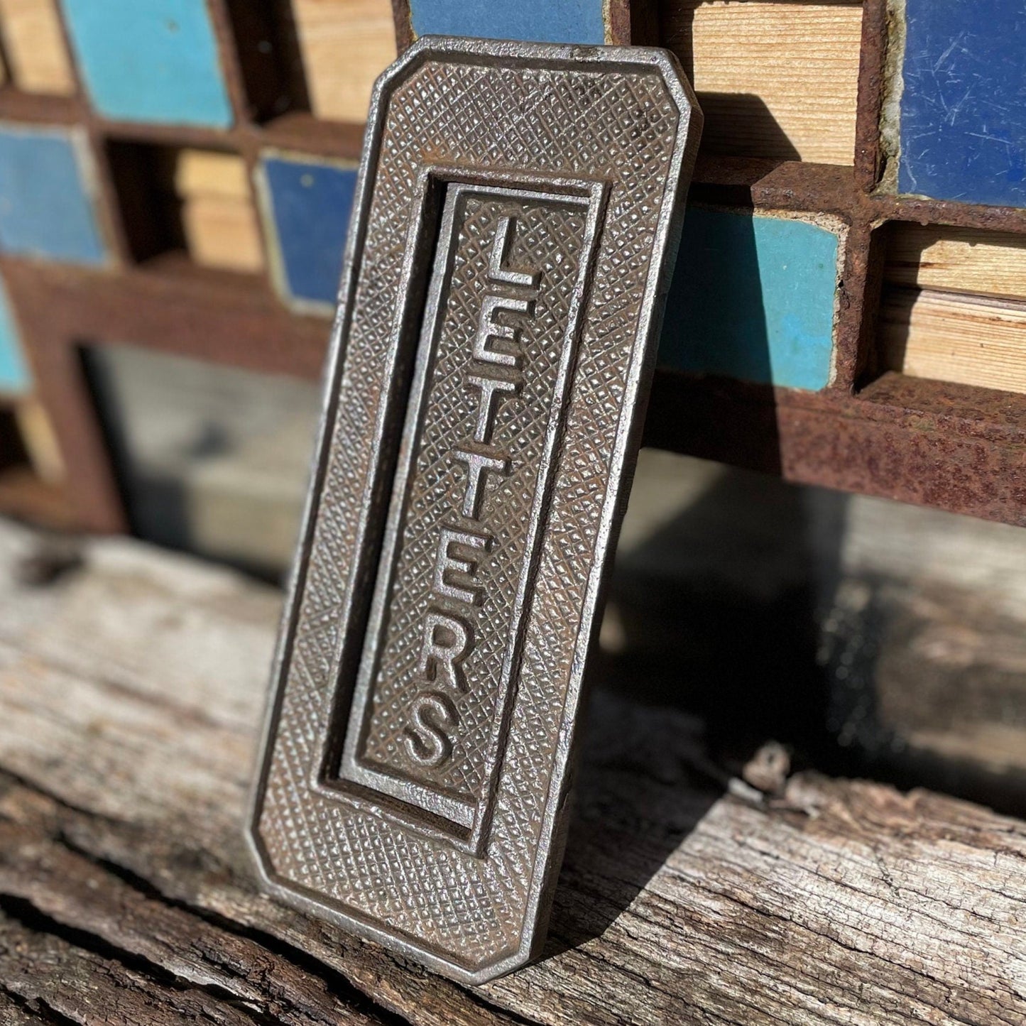 A heavy cast metal antique letter box fascia/flap 19cm tall