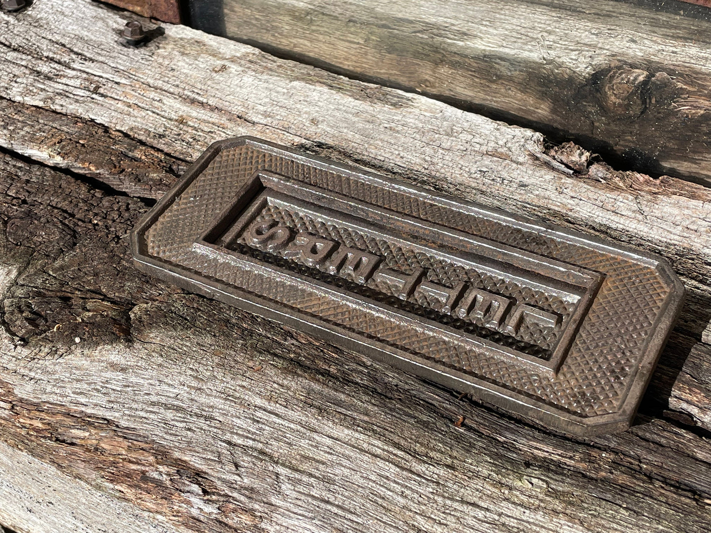 A heavy cast metal antique letter box fascia/flap 19cm tall