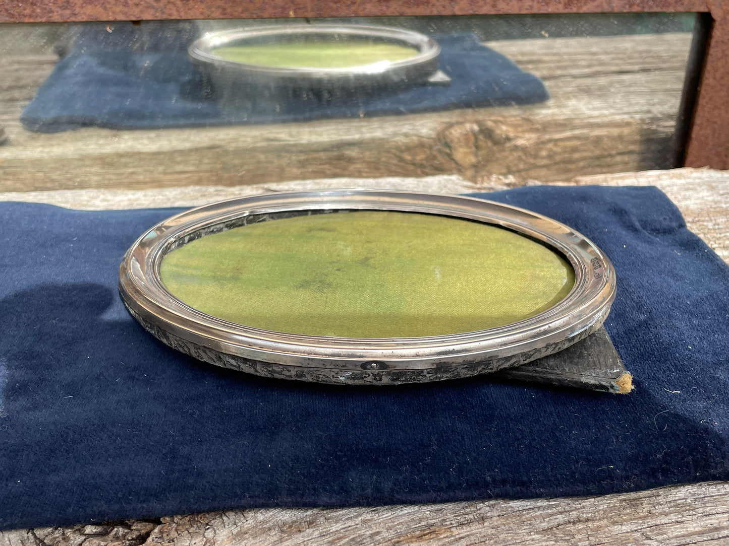 An Oval Sterling hallmarked silver photo frame by H. Matthews Birmingham 1916 - 15x11.5cm