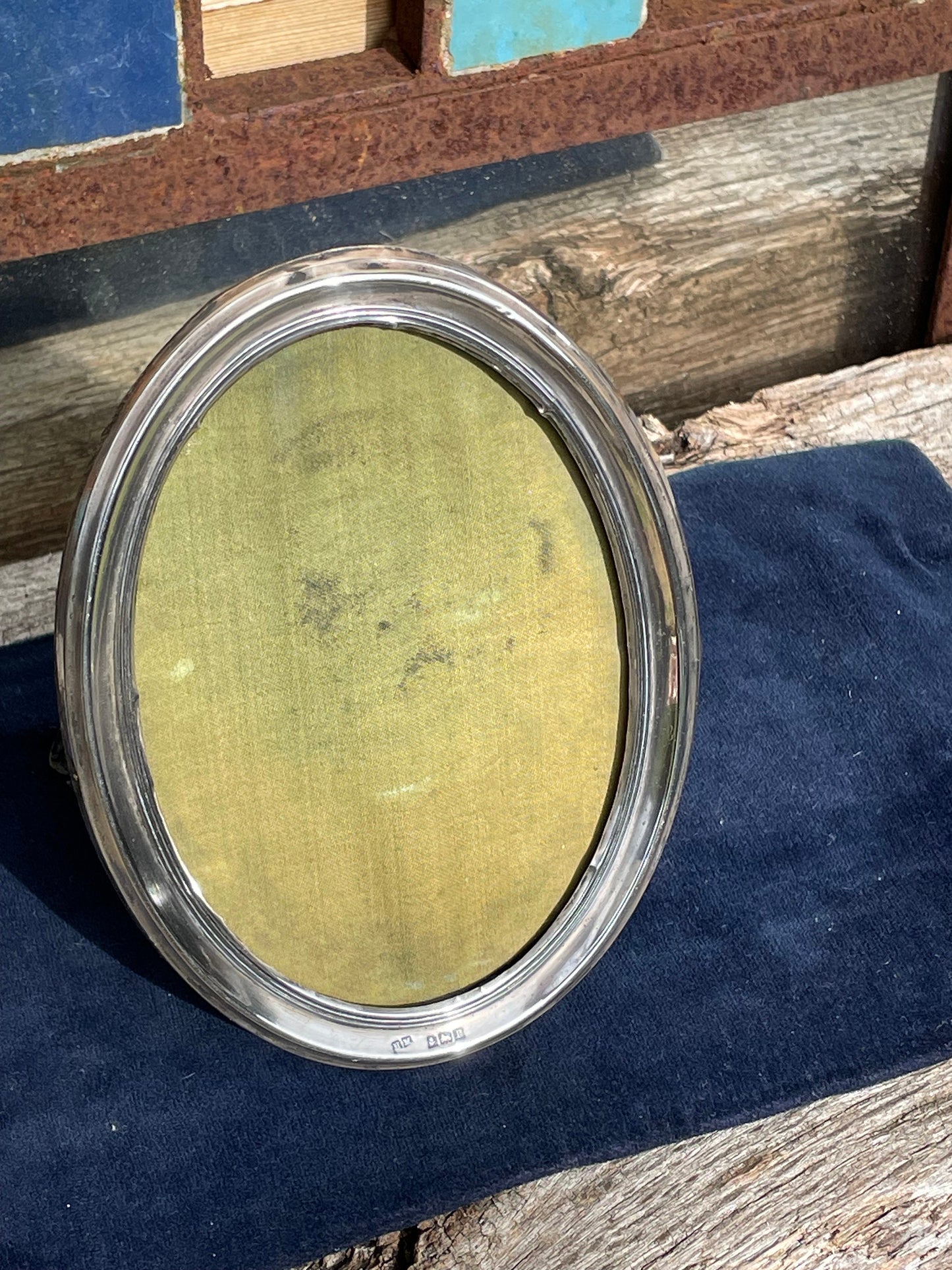 An Oval Sterling hallmarked silver photo frame by H. Matthews Birmingham 1916 - 15x11.5cm