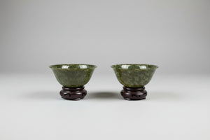 Antique Chinese Jade Bowls – Pair of Polished Spinach-Green Jade Cups on Hardwood Stands (c.20th Century)