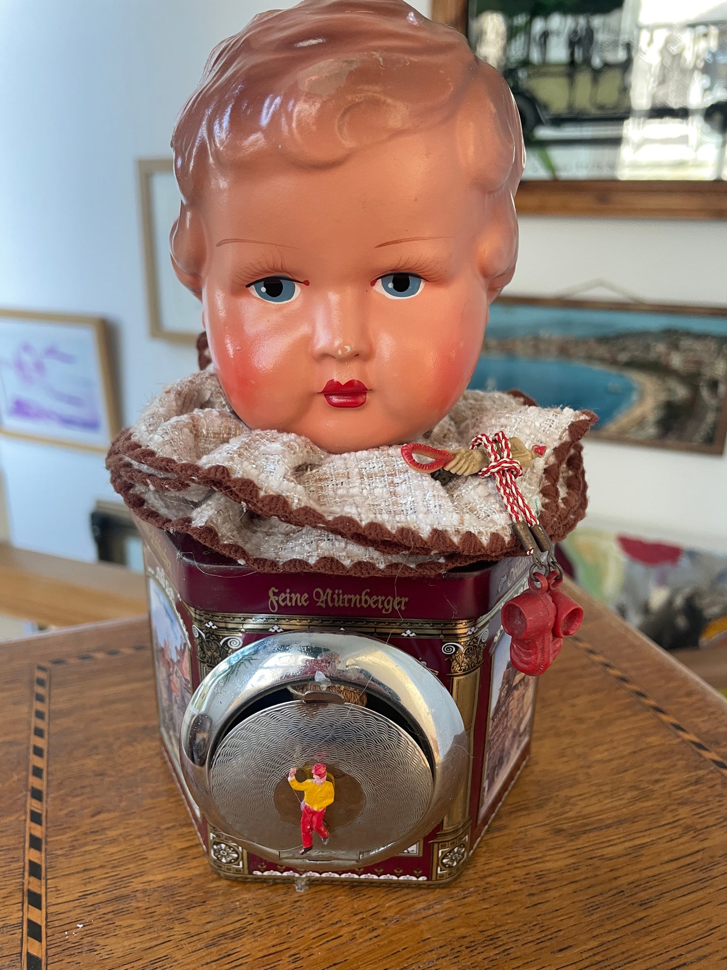 Vintage German “Feine Nürnberger” Tin with Doll Bust Lid & Hidden Miniature Doll –Folk Art Novelty Curio (c.1950s–1970s)