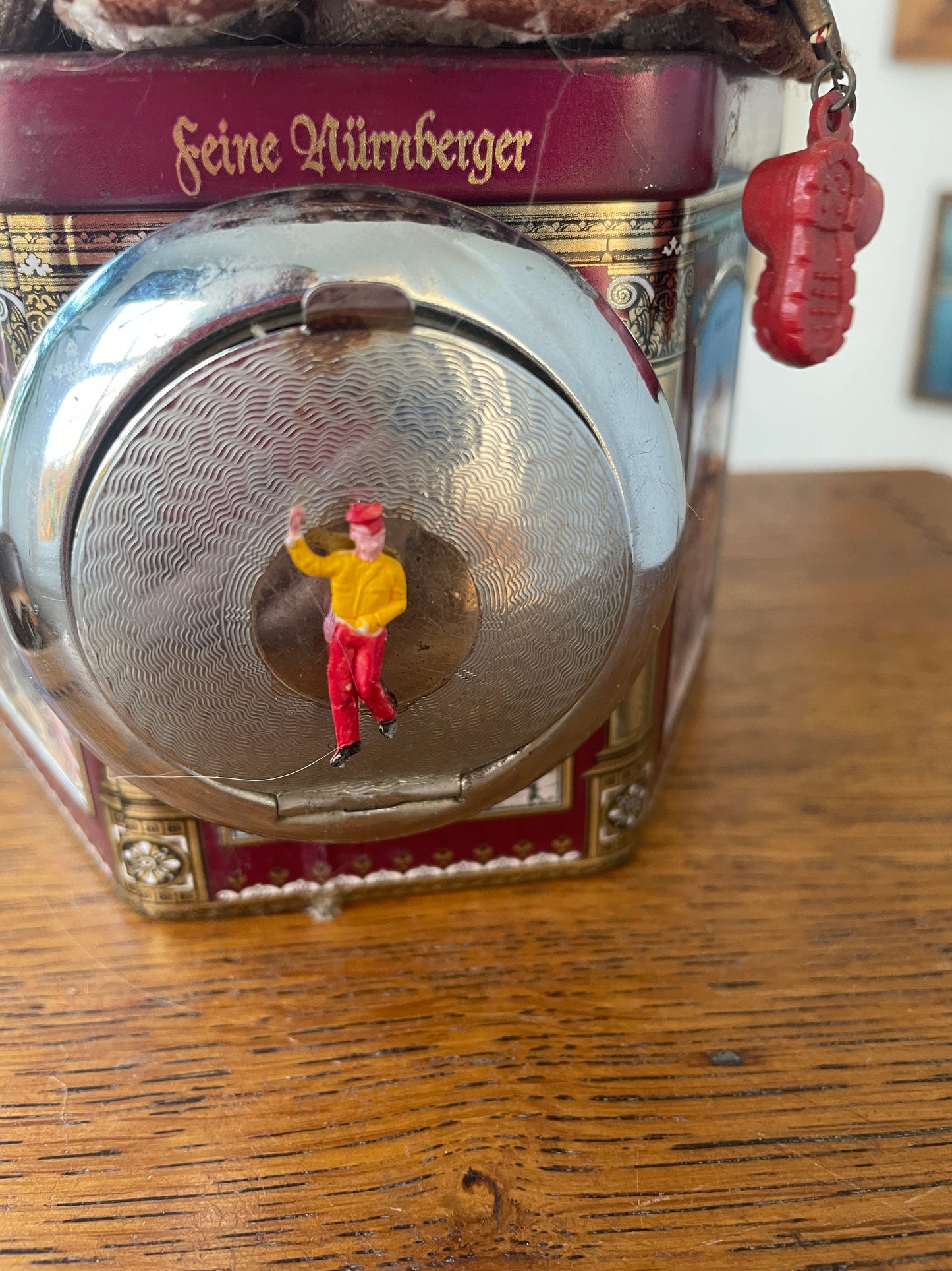 Vintage German “Feine Nürnberger” Tin with Doll Bust Lid & Hidden Miniature Doll –Folk Art Novelty Curio (c.1950s–1970s)