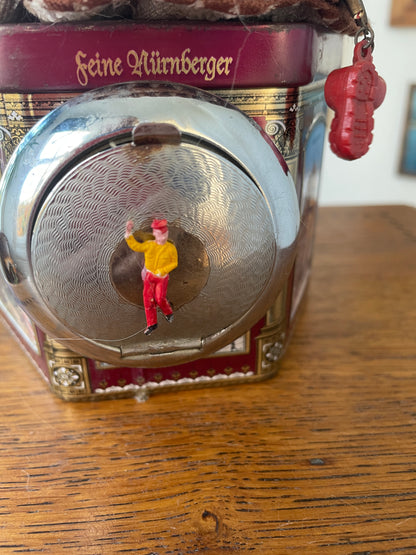 Vintage German “Feine Nürnberger” Tin with Doll Bust Lid & Hidden Miniature Doll –Folk Art Novelty Curio (c.1950s–1970s)