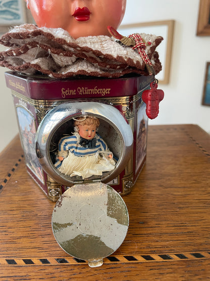 Vintage German “Feine Nürnberger” Tin with Doll Bust Lid & Hidden Miniature Doll –Folk Art Novelty Curio (c.1950s–1970s)