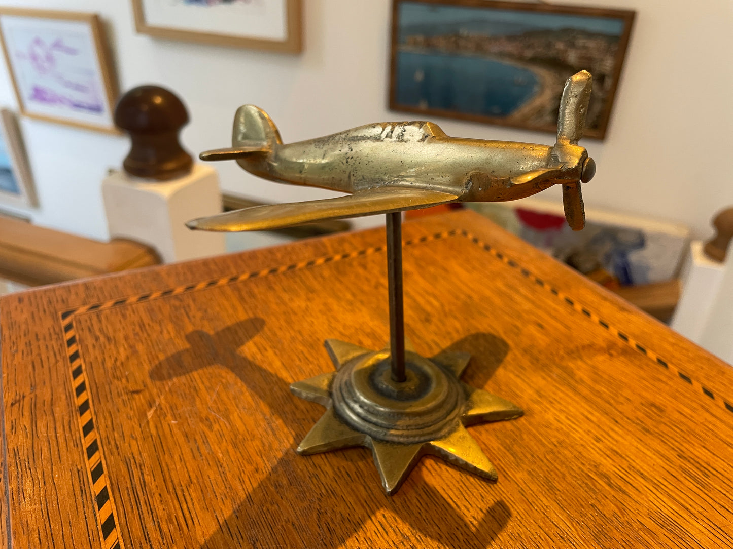 Antique British Brass Spitfire Model – Cast Desktop Aircraft on Starburst Base (c.1940s–50s)