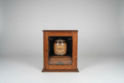 Antique Oak Smokers Cabinet with Bevelled Glass Door and Royal Doulton Lambeth Tobacco Jar (c.1900–1920)