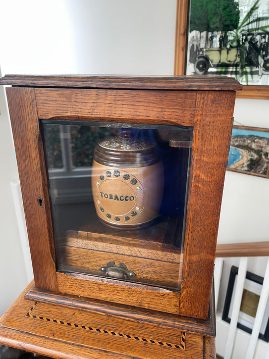 Antique Oak Smokers Cabinet with Bevelled Glass Door and Royal Doulton Lambeth Tobacco Jar (c.1900–1920)