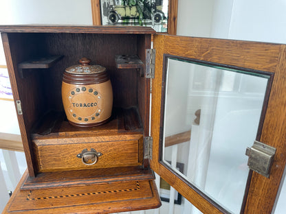 Antique Oak Smokers Cabinet with Bevelled Glass Door and Royal Doulton Lambeth Tobacco Jar (c.1900–1920)