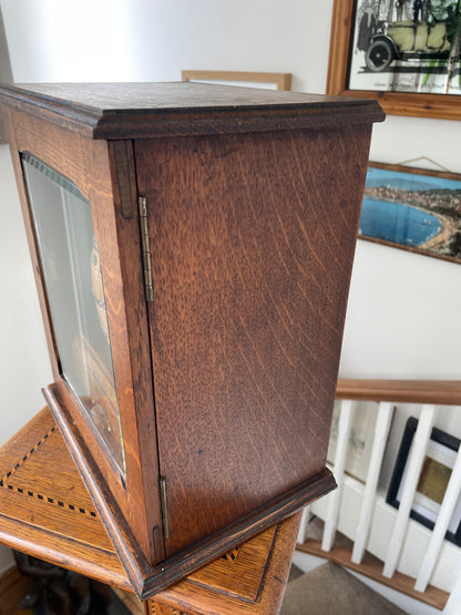 Antique Oak Smokers Cabinet with Bevelled Glass Door and Royal Doulton Lambeth Tobacco Jar (c.1900–1920)