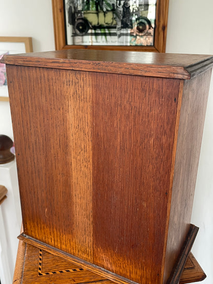 Antique Oak Smokers Cabinet with Bevelled Glass Door and Royal Doulton Lambeth Tobacco Jar (c.1900–1920)