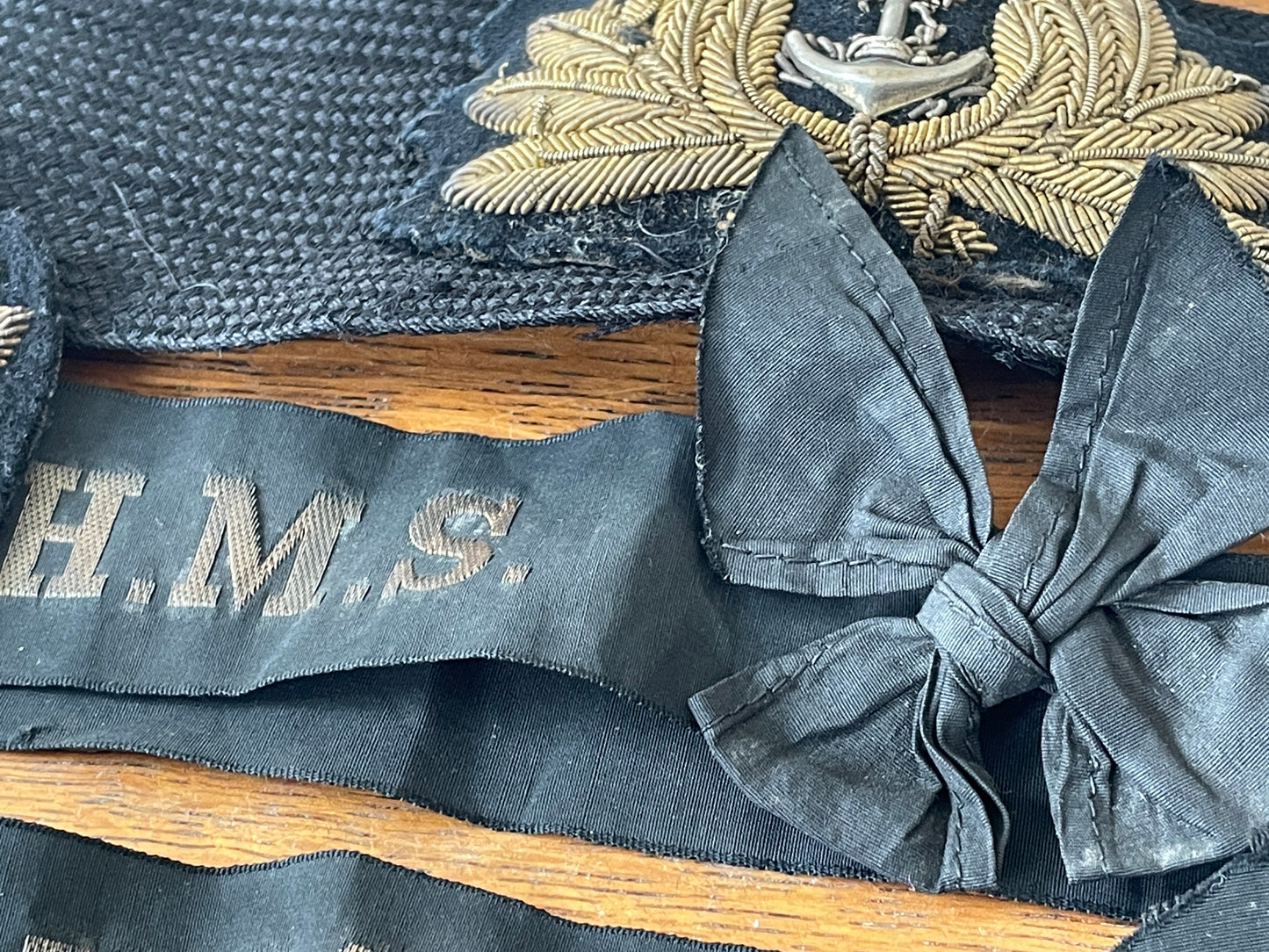 Two Royal Navy Officer Bullion Embroidered Cap Badges with HMS Tally Ribbons and Naval Aviation Wing (c.1955–1970)