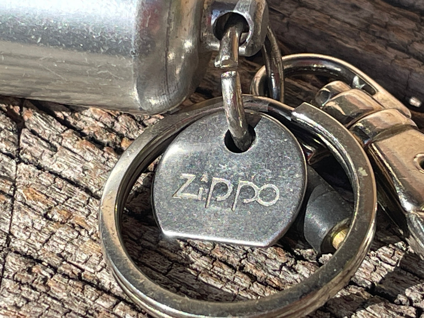 Vintage Zippo fuel cannister, spare flint and Zippo tool on a carabiner clasp