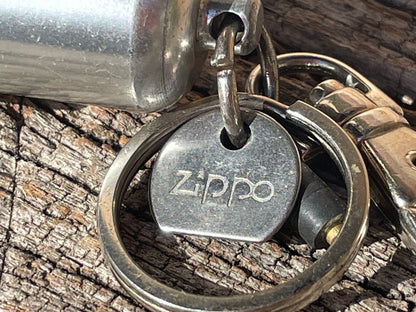 Vintage Zippo fuel cannister, spare flint and Zippo tool on a carabiner clasp