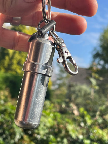 Vintage Zippo fuel cannister, spare flint and Zippo tool on a carabiner clasp